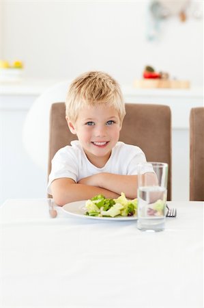 simsearch:400-04792006,k - Cute little boy ready to eat his salad for lunch sitting at a table in the kitchen Stock Photo - Budget Royalty-Free & Subscription, Code: 400-04267334