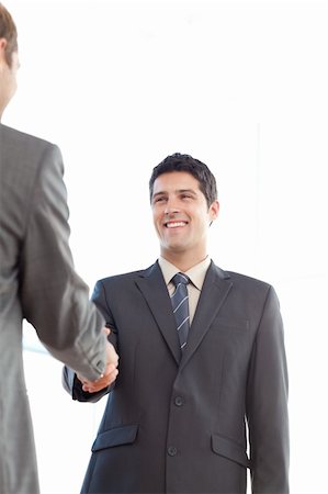 simsearch:400-04235841,k - Delighted businessmen shaking their hands after a meeting at work Stockbilder - Microstock & Abonnement, Bildnummer: 400-04267354