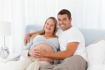 simsearch:400-04266840,k - Cute couple resting together on a bed at home Photographie de stock - Aubaine LD & Abonnement, Code: 400-04267424