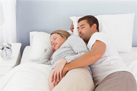 simsearch:400-04266844,k - Cute couple of future parents doing a nap in the bedroom Stock Photo - Budget Royalty-Free & Subscription, Code: 400-04267452