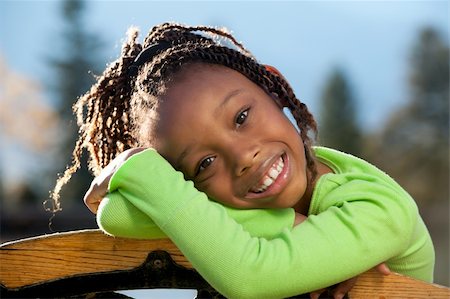 studio1one (artist) - Young African American girl enjoying nice sunny day in a park. Foto de stock - Royalty-Free Super Valor e Assinatura, Número: 400-04268125