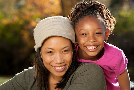 studio1one (artist) - African American mother and child having fun spending time together in a park Foto de stock - Royalty-Free Super Valor e Assinatura, Número: 400-04268214