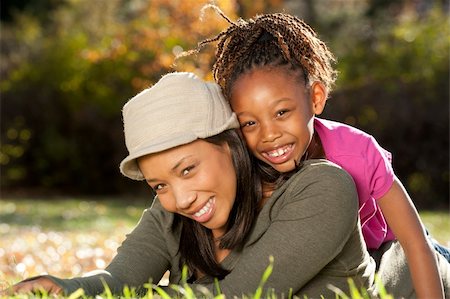 studio1one (artist) - African American mother and child having fun spending time together in a park Foto de stock - Royalty-Free Super Valor e Assinatura, Número: 400-04268213