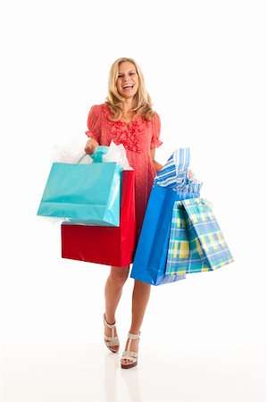simsearch:400-06092781,k - Young woman with shopping bags Photographie de stock - Aubaine LD & Abonnement, Code: 400-04268742