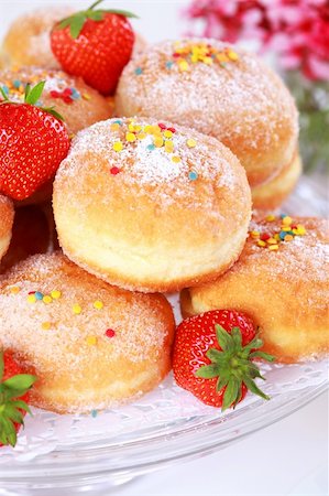 simsearch:400-04677383,k - Doughnut filled with strawberry jam - German national dish with cup of tea Stock Photo - Budget Royalty-Free & Subscription, Code: 400-04268896