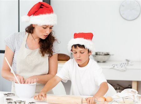 simsearch:400-05749768,k - Mother and son preparing Christmas biscuits together in the kitchen Stock Photo - Budget Royalty-Free & Subscription, Code: 400-04268909