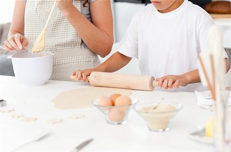 simsearch:400-05749768,k - Close up of mother and son preparing a dough together in the kitchen Stock Photo - Budget Royalty-Free & Subscription, Code: 400-04268914