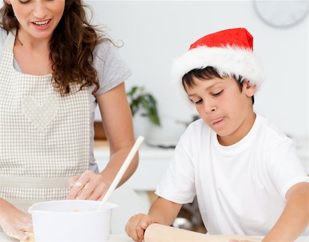 simsearch:400-05749768,k - Cute boy preparing christmas biscuits with his mother in the kitchen Stock Photo - Budget Royalty-Free & Subscription, Code: 400-04268910