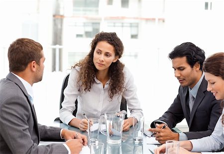 Beautiful manager speaking with her team during a meeting at the office Stock Photo - Budget Royalty-Free & Subscription, Code: 400-04268937