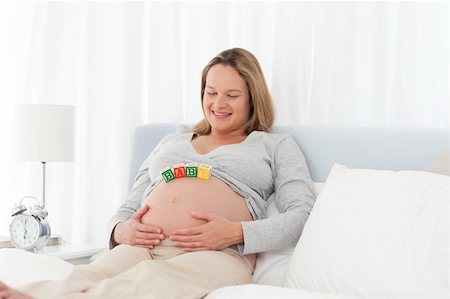 simsearch:400-04266869,k - Tranquil pregnant woman on her bed with baby letters on her belly Stock Photo - Budget Royalty-Free & Subscription, Code: 400-04268960