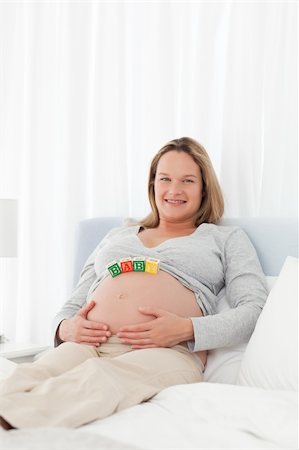 simsearch:400-04266869,k - Tranquil pregnant woman on her bed with baby letters on her belly Stock Photo - Budget Royalty-Free & Subscription, Code: 400-04268961
