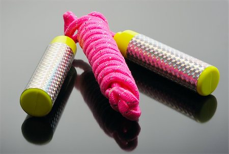Pink skipping rope on a black background Foto de stock - Super Valor sin royalties y Suscripción, Código: 400-04269190