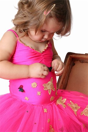 simsearch:400-07302639,k - Little girl with wearing a bright pink tutu standing in an old suitcase Stock Photo - Budget Royalty-Free & Subscription, Code: 400-04269325