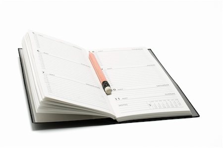 simsearch:400-04777230,k - Pencil  and Pocket Planner on White Background Photographie de stock - Aubaine LD & Abonnement, Code: 400-04269445