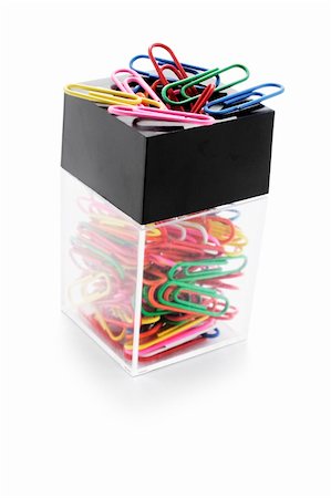 simsearch:400-05290222,k - Paperclips on Holder on White Background Photographie de stock - Aubaine LD & Abonnement, Code: 400-04269500