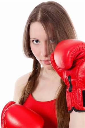 Woman wearing boxing gloves over white background Stock Photo - Budget Royalty-Free & Subscription, Code: 400-04269891