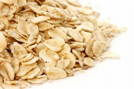 raw oats - Oatmeal flakes scattered on white background Stock Photo - Budget Royalty-Free & Subscription, Code: 400-04260151