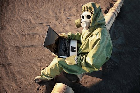 The scientist works with a laptop in a zone of ecological disaster Stock Photo - Budget Royalty-Free & Subscription, Code: 400-04261330