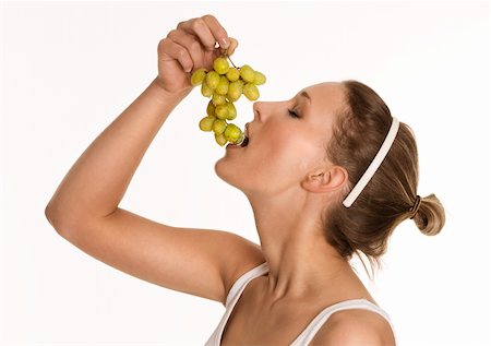 Pretty young woman enjoying fresh grapes Stock Photo - Budget Royalty-Free & Subscription, Code: 400-04261405
