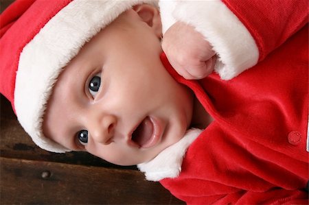 family relaxing at christmas - Cute 6 week old baby boy wearing a christmas suit Stock Photo - Budget Royalty-Free & Subscription, Code: 400-04261788