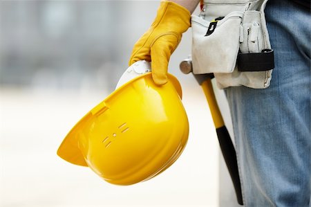 simsearch:400-07716868,k - builder with yellow helmet and working gloves on building site Stock Photo - Budget Royalty-Free & Subscription, Code: 400-04262869