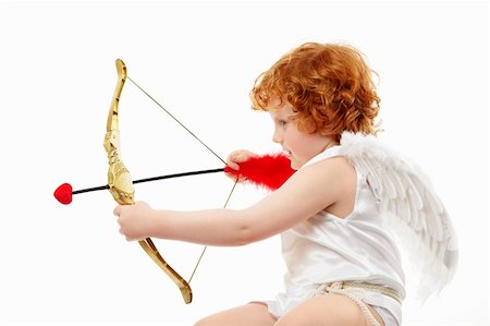 Profile of the aiming small cupid isolated on a white background Photographie de stock - Aubaine LD & Abonnement, Code: 400-04262982