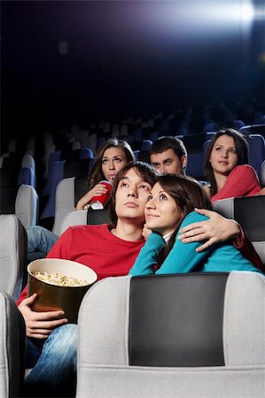 Enamoured couple at cinema in the foreground Stock Photo - Budget Royalty-Free & Subscription, Code: 400-04263006
