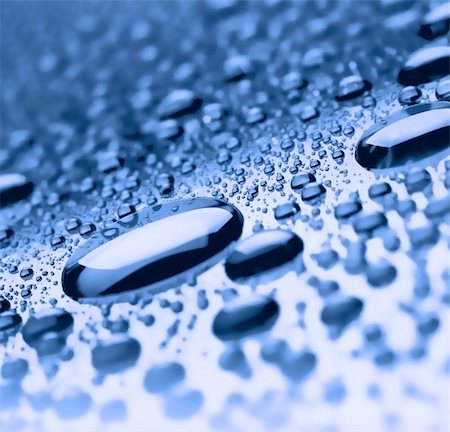 blue liquid drops on the sliding surface Foto de stock - Super Valor sin royalties y Suscripción, Código: 400-04263015