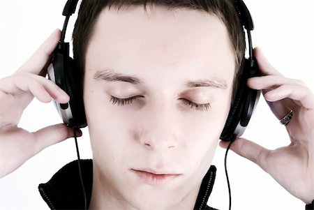 simsearch:400-05349451,k - Young man in headphones relaxing to the sound of music Foto de stock - Super Valor sin royalties y Suscripción, Código: 400-04263131