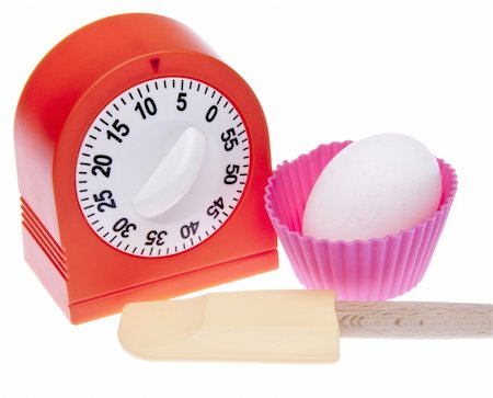 simsearch:400-07916427,k - Kitchen Timer, spatula, cupcake wrapper and egg for cooking or baking themed image.  Isolated on white with a clipping path. Foto de stock - Super Valor sin royalties y Suscripción, Código: 400-04263207