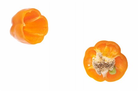 simsearch:400-04300929,k - Vibrant Orange Pepper Sliced with Seeds Showing Isolated on White with a Clipping Path. Foto de stock - Royalty-Free Super Valor e Assinatura, Número: 400-04263620
