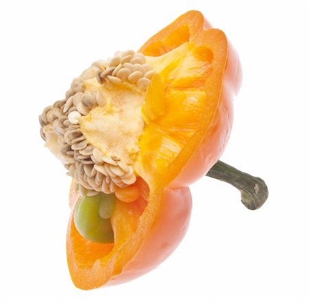 simsearch:400-04300929,k - Vibrant Orange Pepper Sliced with Seeds Showing Isolated on White with a Clipping Path. Foto de stock - Royalty-Free Super Valor e Assinatura, Número: 400-04263622