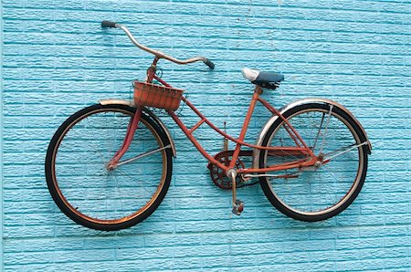 red bicycle nobody - Vintage Bicycle on a Blue Brick Wall with a Basket. Stock Photo - Budget Royalty-Free & Subscription, Code: 400-04263707