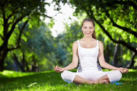 Young girl in lotus pose in the park Stock Photo - Budget Royalty-Free & Subscription, Code: 400-04274906