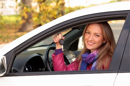 simsearch:400-06415950,k - Happy owner of a new car showing a key. Stock Photo - Budget Royalty-Free & Subscription, Code: 400-04275188