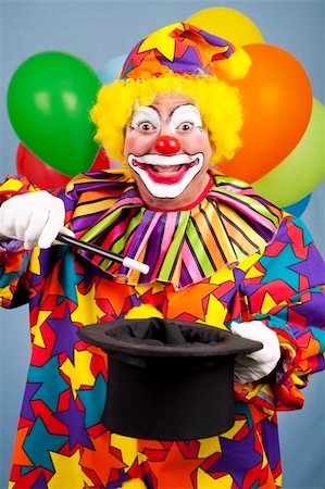 simsearch:400-04408991,k - Happy birthday clown does a magic trick with a top hat and wand. Foto de stock - Super Valor sin royalties y Suscripción, Código: 400-04275695