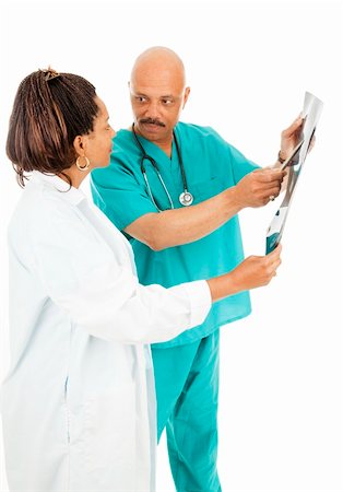 plaited hair for men - Good-looking doctors discussing a patient's x-rays.  Isolated on white. Foto de stock - Super Valor sin royalties y Suscripción, Código: 400-04275698