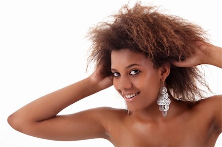 beautiful black woman, holding her hair with his hands, isolated on white background Stock Photo - Budget Royalty-Free & Subscription, Code: 400-04275747