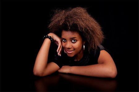 beautiful black  woman, isolated on black background.studio shot. Foto de stock - Super Valor sin royalties y Suscripción, Código: 400-04275754