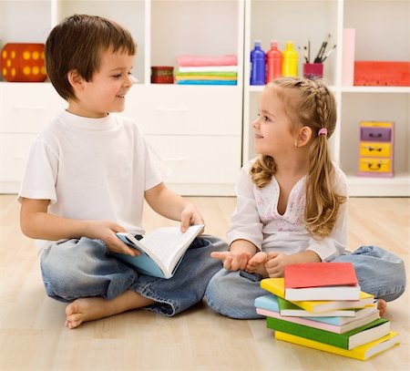 Let me tell you about school - siblings with books talking at home, back to school concept Stock Photo - Budget Royalty-Free & Subscription, Code: 400-04276249