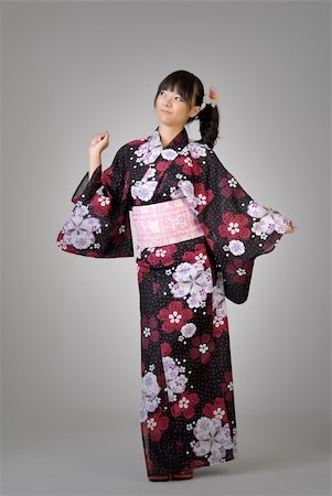 dancing black girl figure - Happy japanese girl dancing, full length portrait in studio gray background. Stock Photo - Budget Royalty-Free & Subscription, Code: 400-04276480