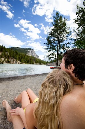 A couple relaxing near a river in Banff, Canada Stock Photo - Budget Royalty-Free & Subscription, Code: 400-04276657