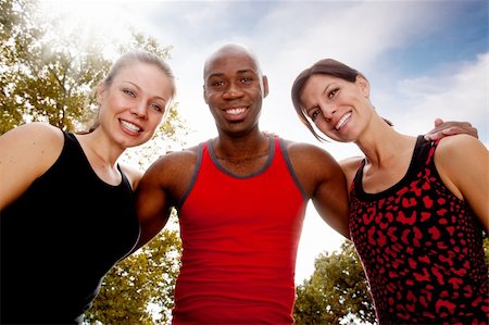 fall friends group - A group of friends exercising in the park on a warm sunny day Stock Photo - Budget Royalty-Free & Subscription, Code: 400-04276855