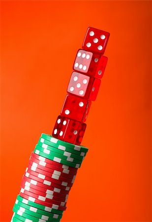 simsearch:625-01749129,k - Casino chips and cards against red background Stockbilder - Microstock & Abonnement, Bildnummer: 400-04277098