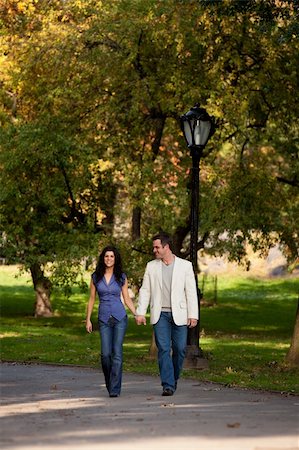 friendship proposal to girl pic - A happy couple walking in the park Stock Photo - Budget Royalty-Free & Subscription, Code: 400-04277282