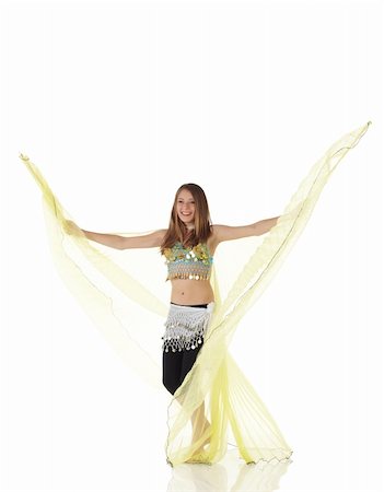 Young Caucasian belly dancing girl in beautiful decorated clothes on white background and reflective floor. Not isolated Stock Photo - Budget Royalty-Free & Subscription, Code: 400-04277906