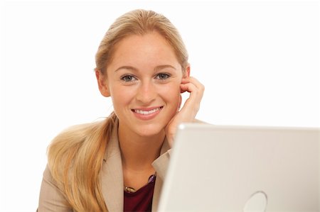 simsearch:400-05732500,k - Portrait of young business girl sitting at desk with laptop Foto de stock - Royalty-Free Super Valor e Assinatura, Número: 400-04278573