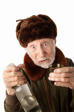 simsearch:400-04227846,k - Senior Russian Man in Fur Cap and Jacket with Vodka Fotografie stock - Microstock e Abbonamento, Codice: 400-04278949