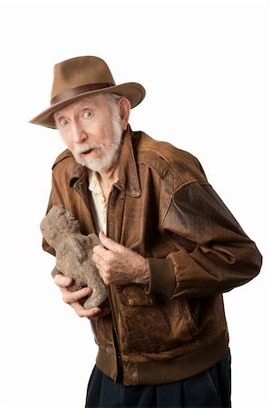Adventurer or archaeologist in brown leather jacket with stolen idol Stock Photo - Budget Royalty-Free & Subscription, Code: 400-04278940
