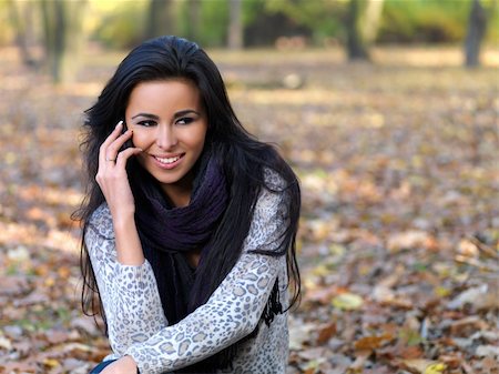 Beautiful woman spending time in park during autumn season Stock Photo - Budget Royalty-Free & Subscription, Code: 400-04279273